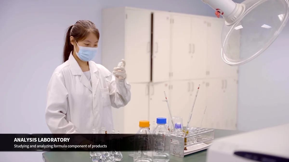 Laboratory worker handling a sample with a pipette